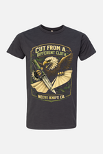Gray t-shirt featuring a vintage-style graphic of an eagle clutching a knife and a torn piece of cloth, with the text “Cut From a Different Cloth” above and “Neeve Knife Co.” below.