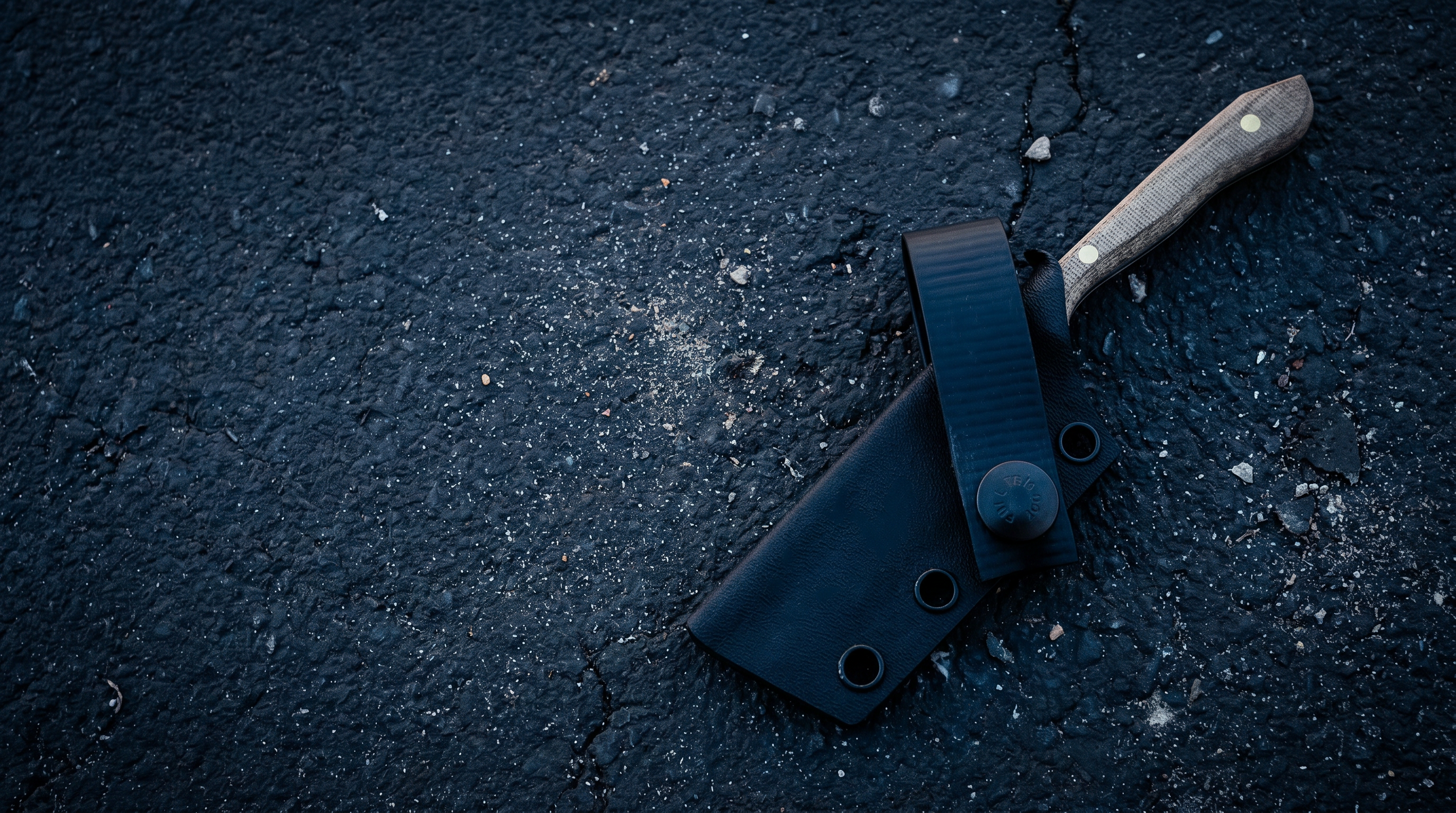 Neeve Knife Co. Shiv with sheath on a dark textured surface
